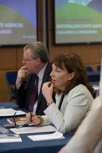 Two business people sitting at a desk